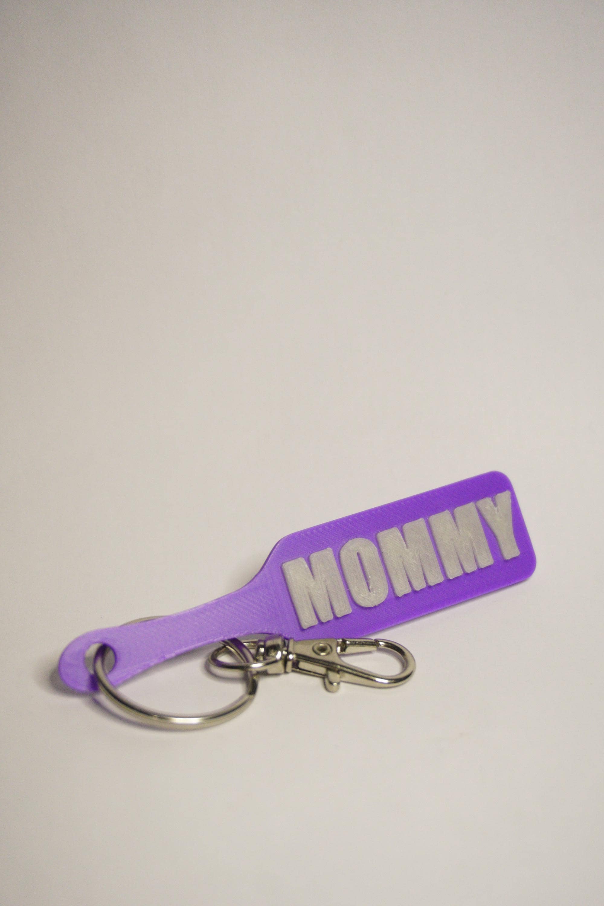 MOMMY Paddle Keychain - Jester Collection (Glowy Green & Purple)  - Kinky BDSM 3d-Printed Accessory (etsy image id: 8043531931)
